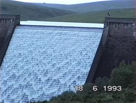 Chris and Paul Oakley get close up and personal with the Avon Dam, which is in full flow this evening